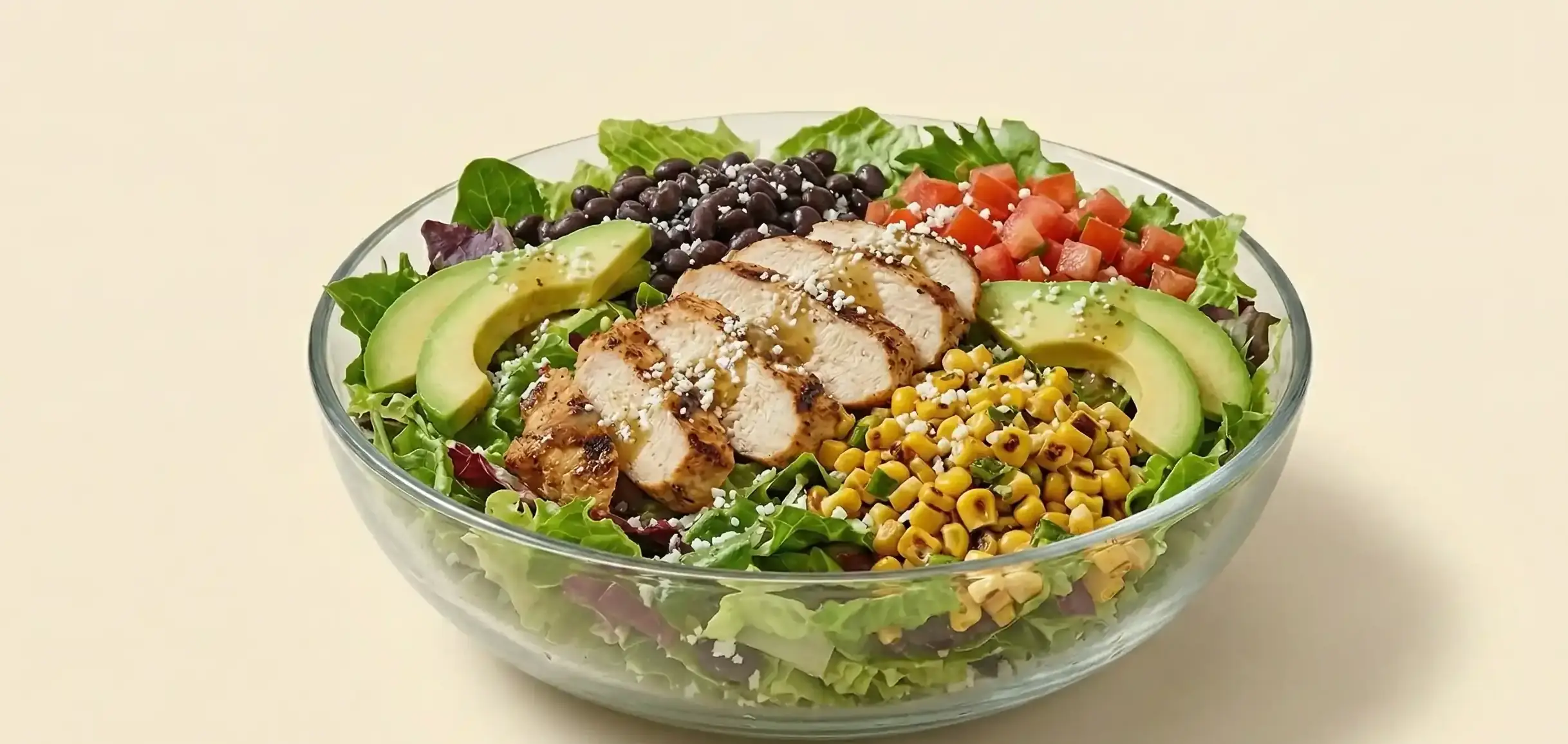 Chipotle-inspired salad cutout on a warm cream background