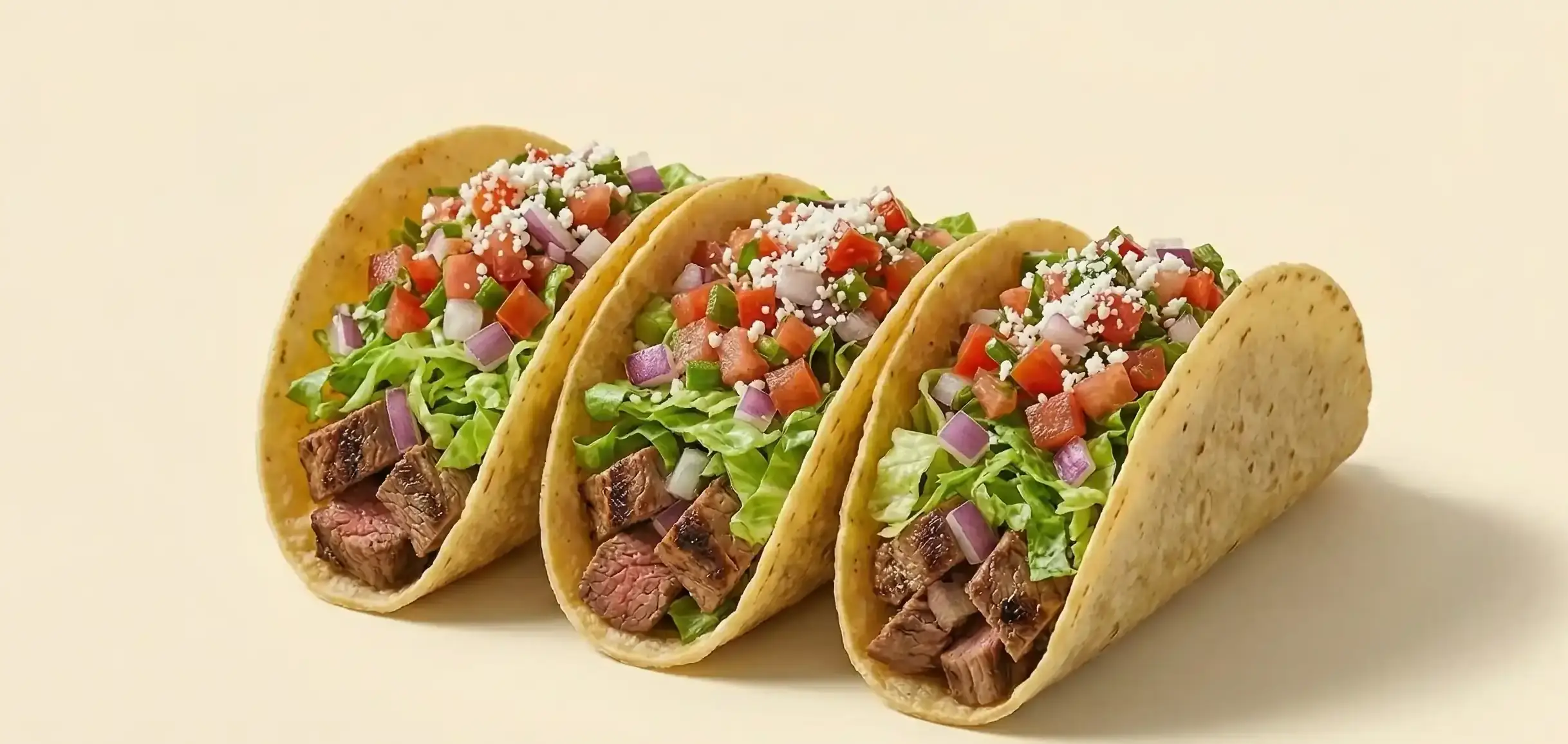 Chipotle-inspired tacos cutout on a warm neutral background